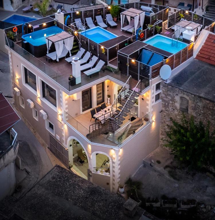 an overhead view of a house with two swimming pools at Villa Iasonas in Kournás