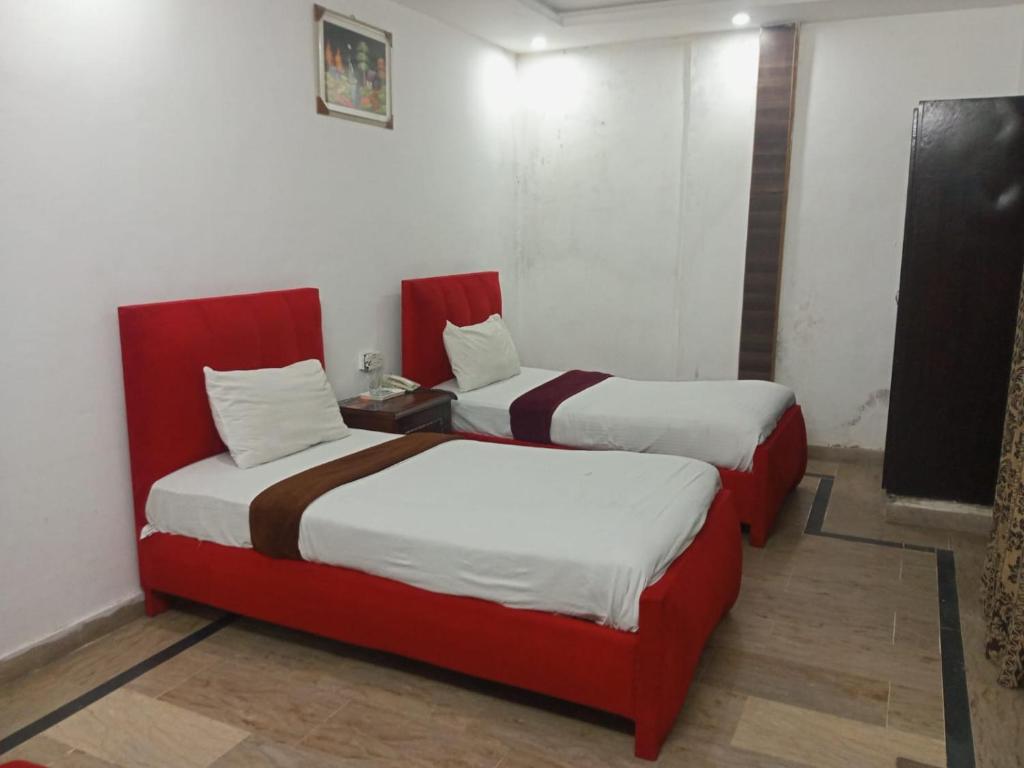 Postel nebo postele na pokoji v ubytování Hotel The Tulip