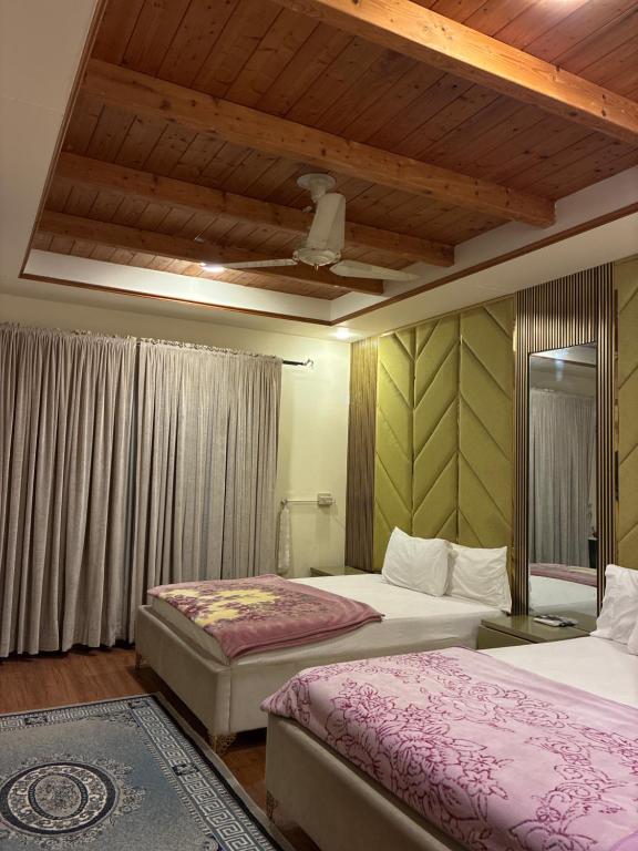 Postel nebo postele na pokoji v ubytování Leisure Stay 2