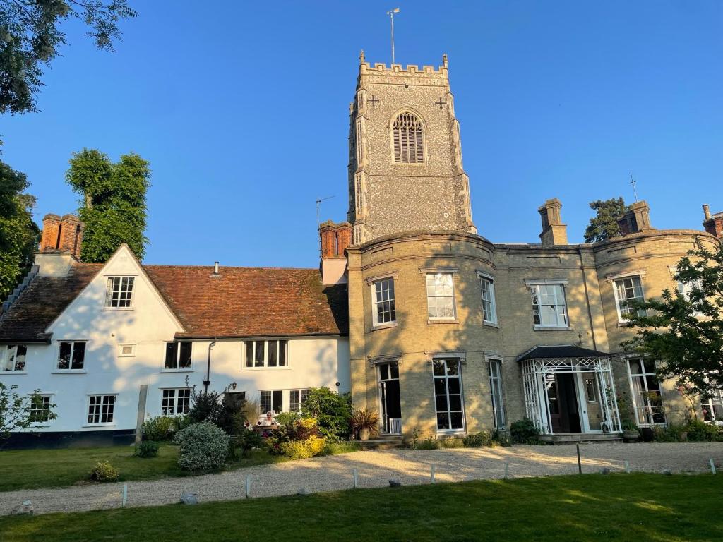 an old building with a tower on top of it at The Old Rectory Framlingham in Framlingham