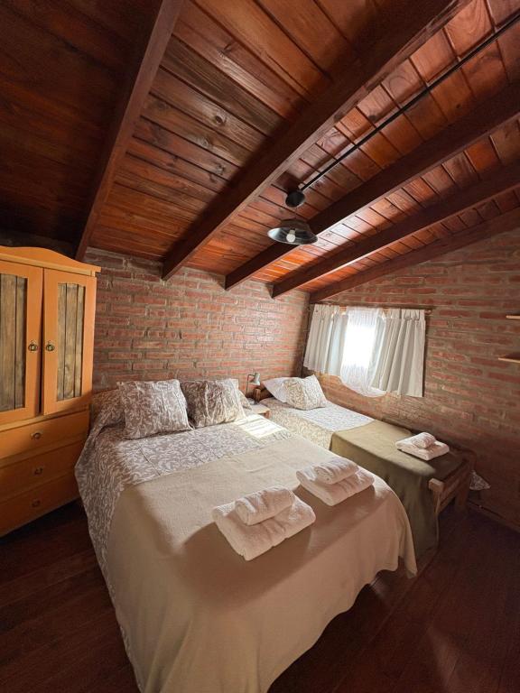 Ένα ή περισσότερα κρεβάτια σε δωμάτιο στο Sierra Dulce