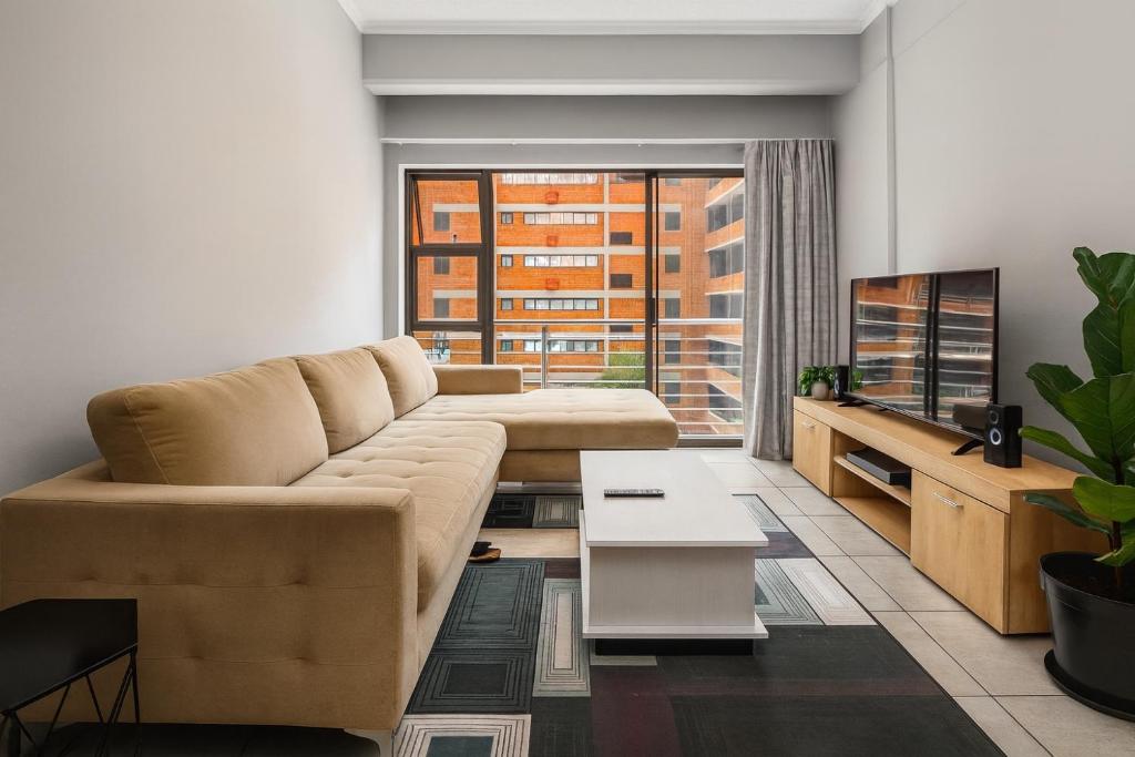 Et opholdsområde på Luxury Modern Apartment