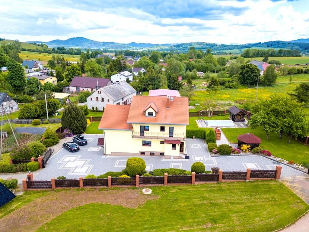 an aerial view of a house with a yard at Słoneczny dom w górach, Sauna, basen Karpacz Opawa in Lubawka