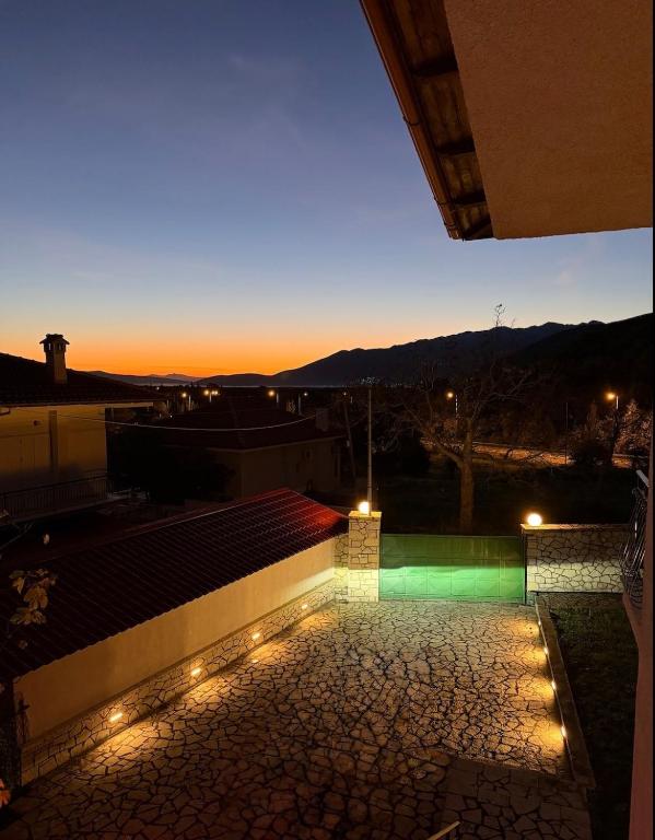 a view of a rooftop at night with lights at Kastellia Horizon Villa in Graviá