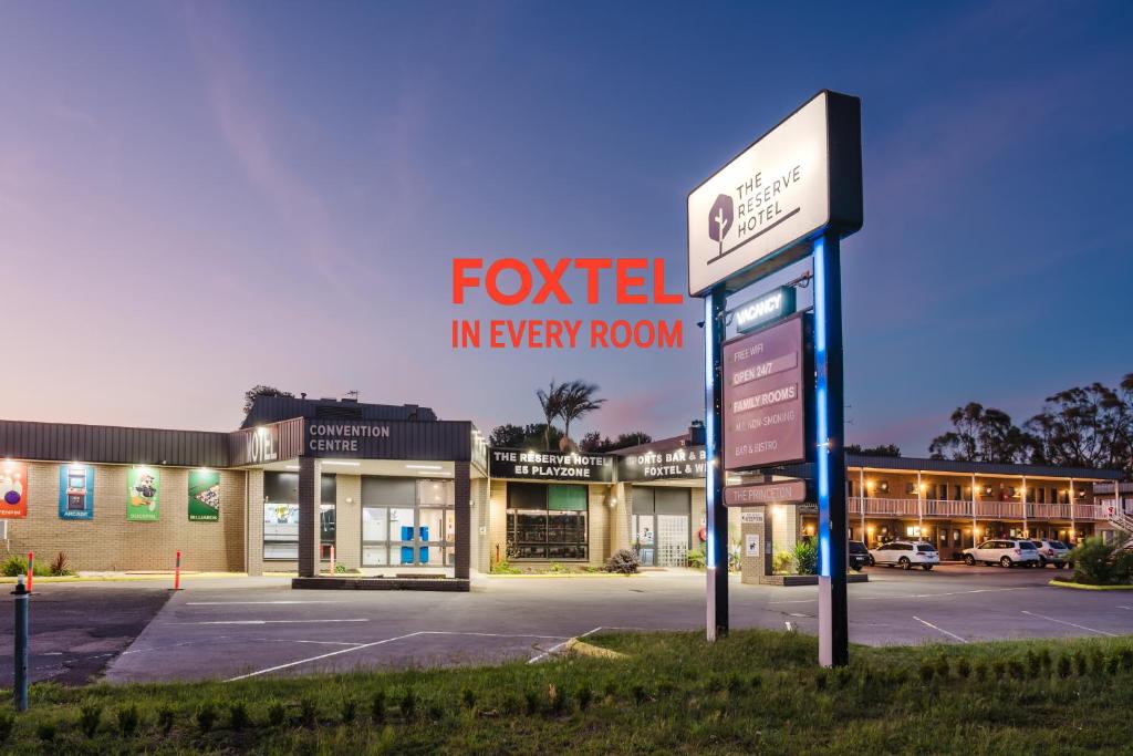 a sign for a hotel in every room at The Reserve Hotel in Sale