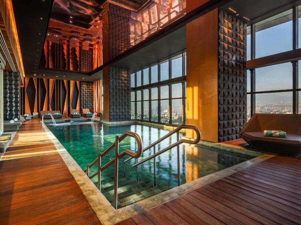 a swimming pool in a hotel room with a view at Sofitel Mexico City Reforma in Mexico City