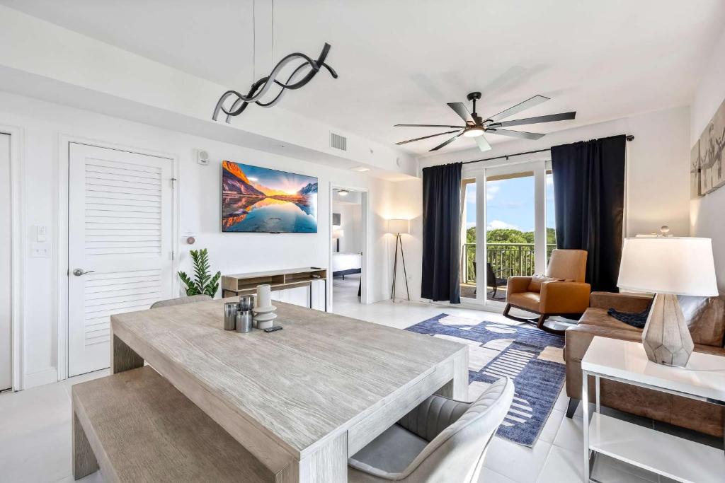 a living room with a dining table and a couch at RIVER FLY IN The Cocoa Island Horizon View RFI 3BR KQQ City in Audubon