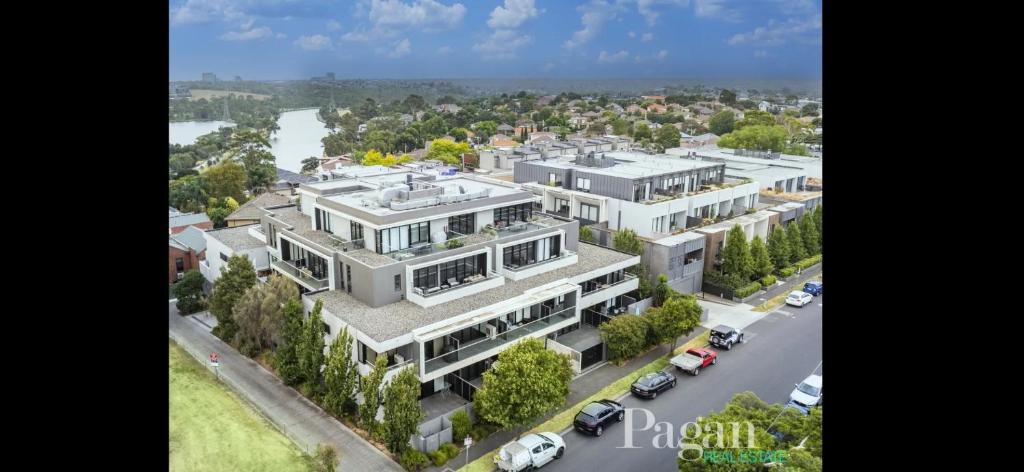 an aerial view of a large white building with a street at Ascot Hill in Melbourne