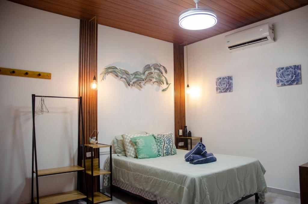 Giường trong phòng chung tại Sunzal Tropical 9