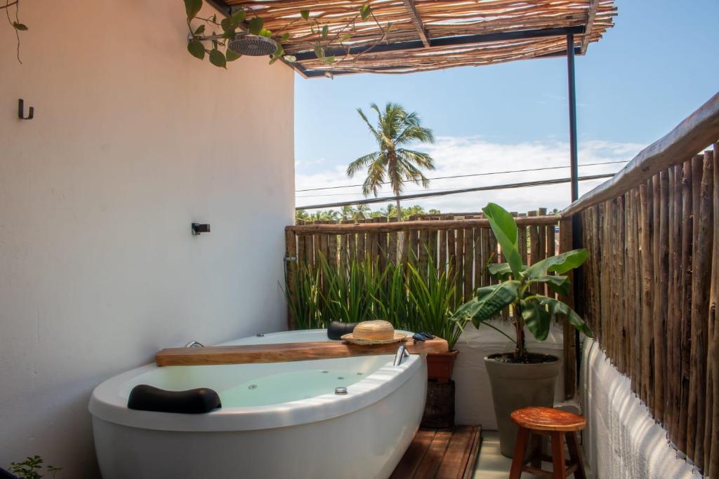 Fotografie z fotogalerie ubytování Nomad Palmeira Duplex com Hidromassagem privativa v destinaci Pôrto de Pedras