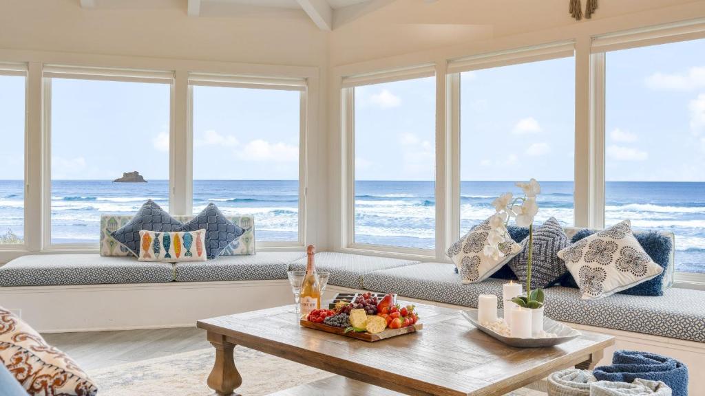 a living room with a view of the ocean at Sanctuary by the Sea by AvantStay Waterfront Views in Arch Cape