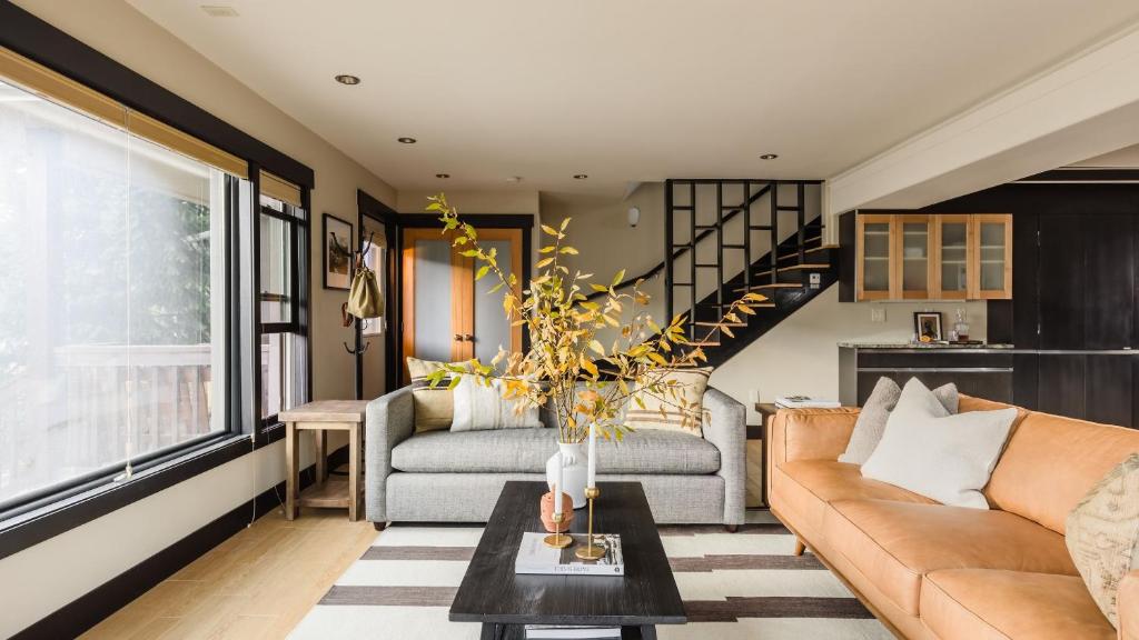 a living room with a couch and a table at Paddington by AvantStay Cozy Chic Ski Lodge Mins from Mountain in Breckenridge