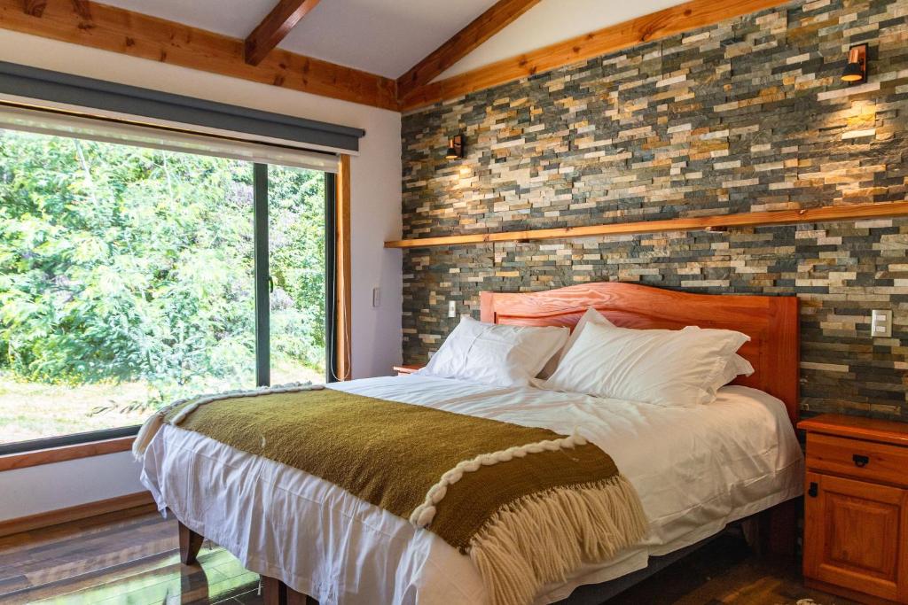 Postel nebo postele na pokoji v ubytování Lican Lodge