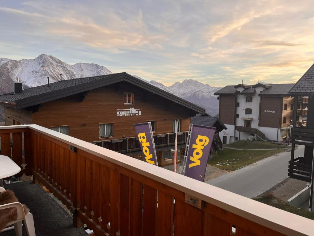 a balcony of a building with a view of mountains at Chalet Alpenheim 2 OG in Bettmeralp