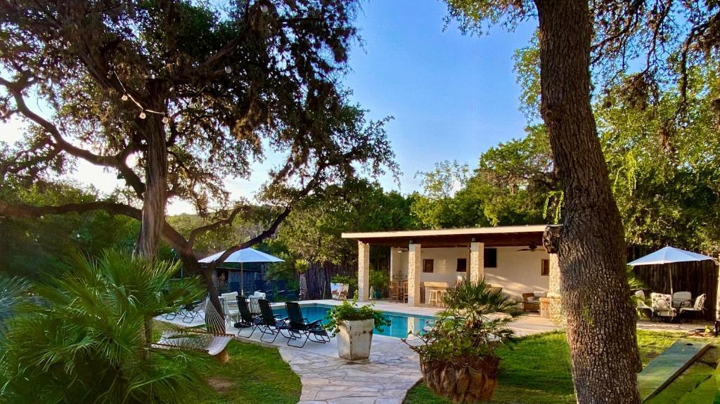 a house with a swimming pool in a yard at Agave Point in Concan
