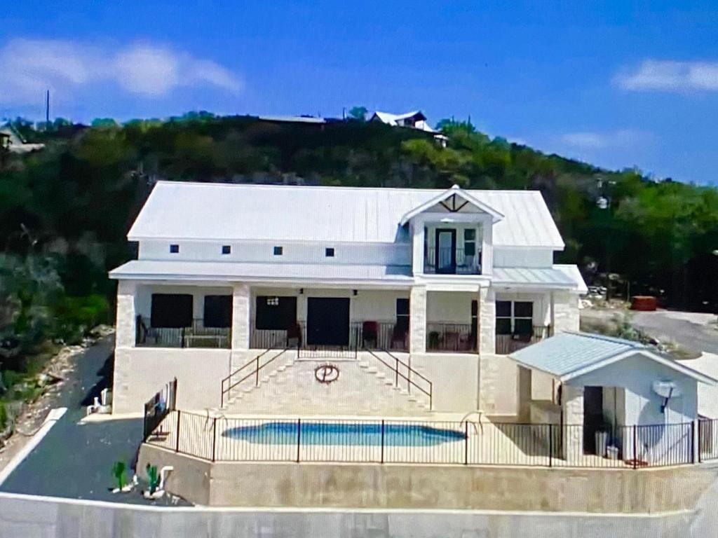 an aerial view of a house with a pool at Pretty Penny in Concan
