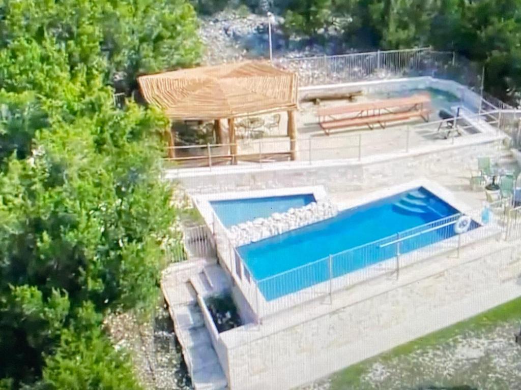 an overhead view of a swimming pool in a house at HILLSIDE in Concan