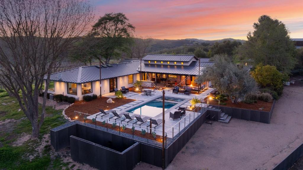 an aerial view of a house with a swimming pool at Wine Country Estate w Pool Hot Tub The Residence at Truss Wines by AvantStay in Paso Robles