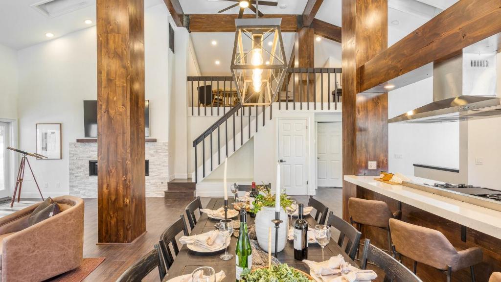 a dining room with a table and chairs at Explorer by AvantStay Close to Slopes Game Room Guest Suite Hot Tub in Alpine Meadows