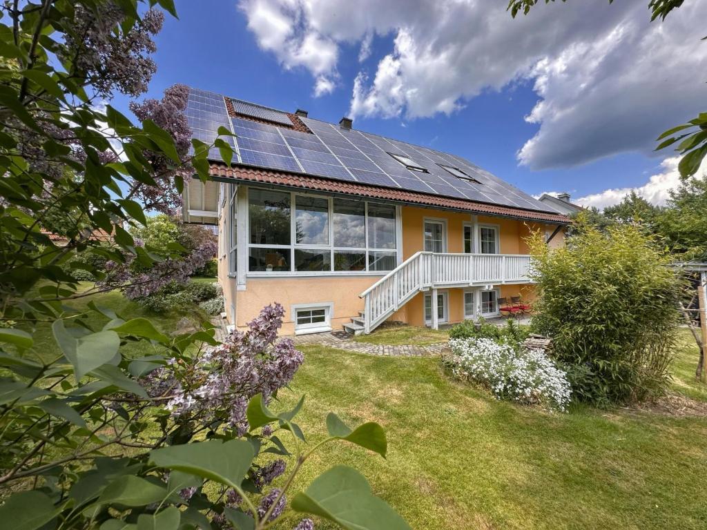 a house with solar panels on the roof at Zur Gradlhöhe in Schönsee