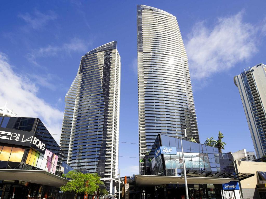 two tall skyscrapers in a city with buildings at Mantra Circle On Cavill in Gold Coast