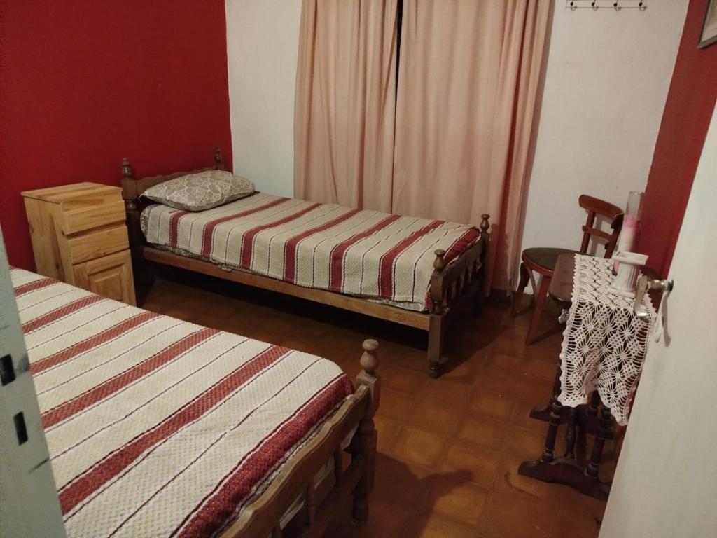 Ένα ή περισσότερα κρεβάτια σε δωμάτιο στο Casa Los Abuelos