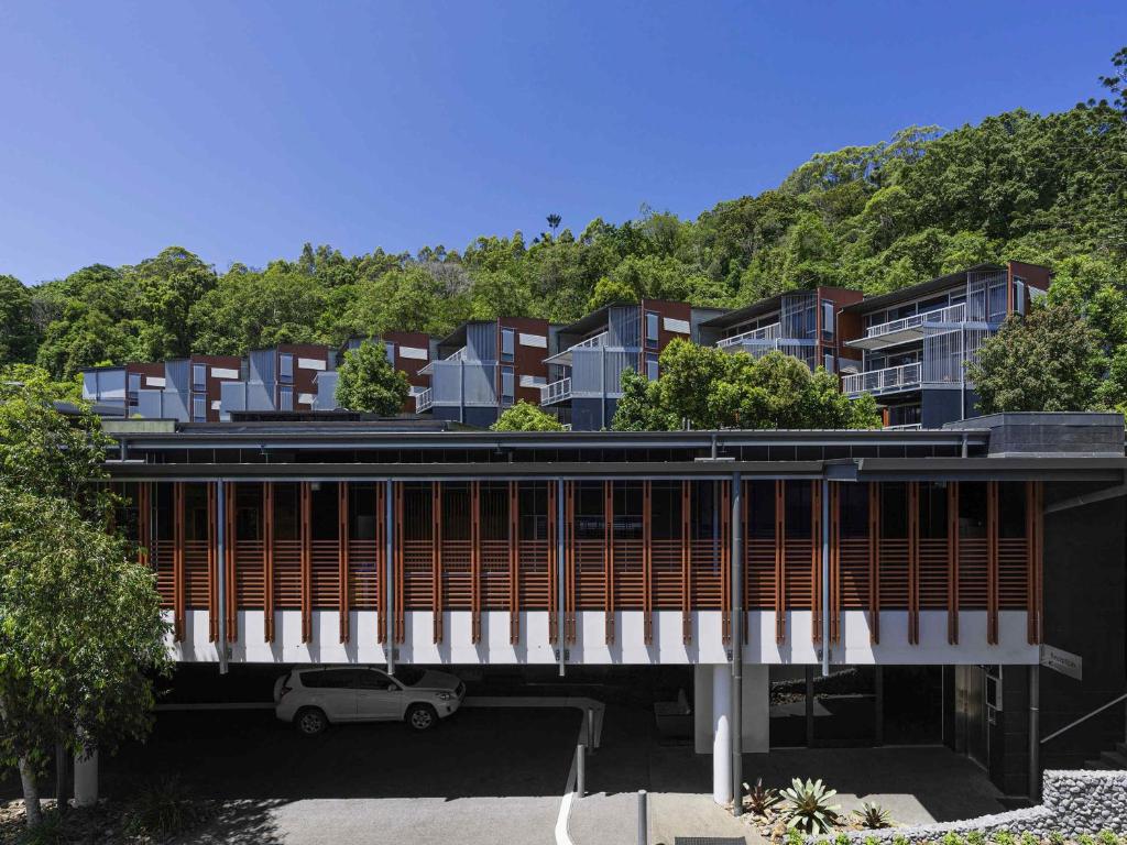 a building with a bridge over a parking lot at Peppers Noosa Resort and Villas in Noosa Heads