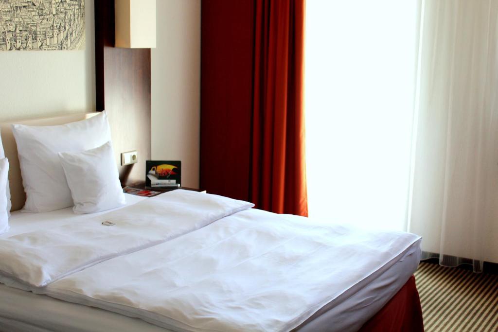 Postel nebo postele na pokoji v ubytování Best Western Hotel Nürnberg City West