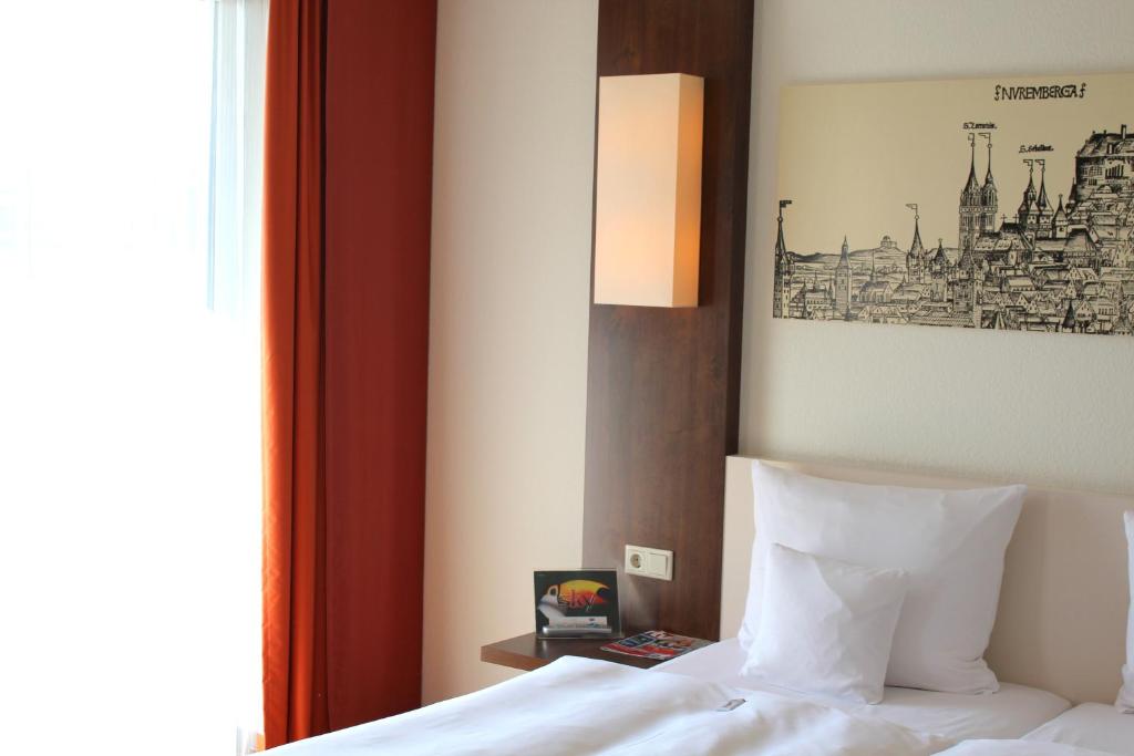 Postel nebo postele na pokoji v ubytování Best Western Hotel Nürnberg City West