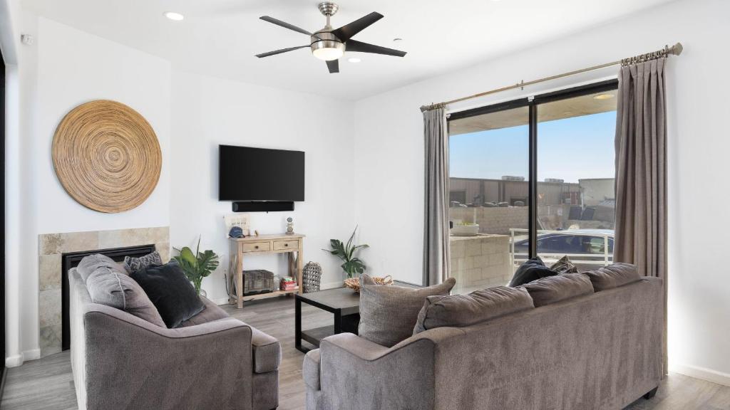 a living room with a couch and a fireplace at Oceanfront 2BR Rooftop Deck Beach Access Strand Way B in Oceano