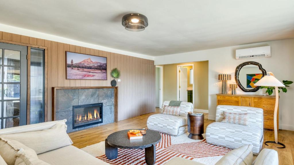 a living room with a couch and a fireplace at Walk to Beach Shops Fireplace Patio Dining Firepit at Manzanita Ave. in Manzanita