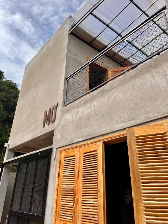 a building with themt sign on the side of it at Mơ House Eco Homestay on hill in Phú Quốc