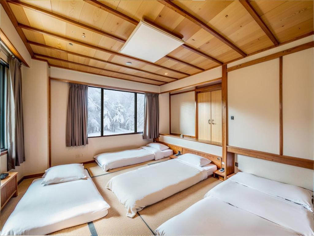 Ένα ή περισσότερα κρεβάτια σε δωμάτιο στο Wonderwall美好境界 日本藏王館