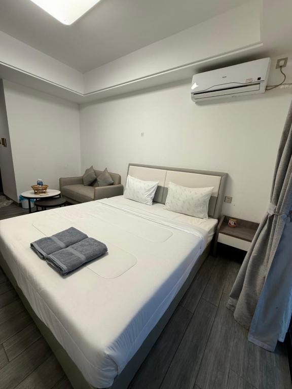 Кровать или кровати в номере SB Condo Sihanoukville -700m to U MALL