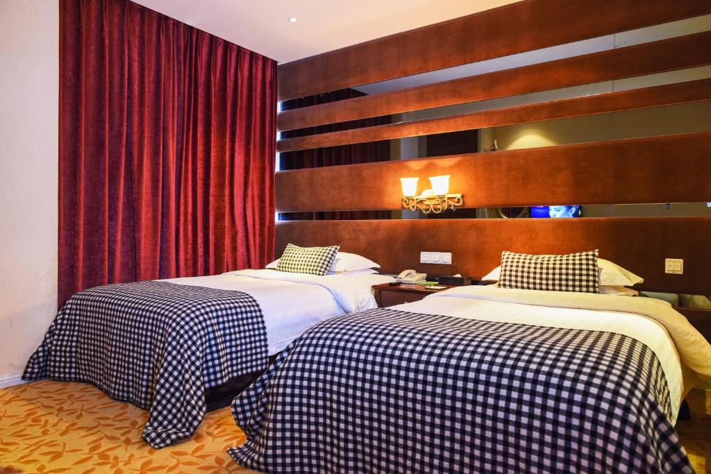 Ένα ή περισσότερα κρεβάτια σε δωμάτιο στο Aoting Garden Hotel