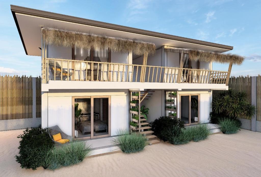 een huis met een balkon erbovenop bij CozyShell in General Luna
