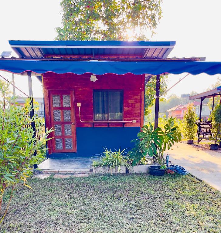 a small red and blue house with a blue roof at Lamai home 4 in Ko Yao Noi