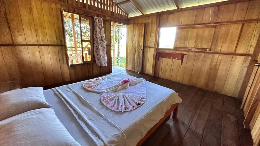 a room with a bed with a towel on it at Finca hotel VillaLuna in Mesetas