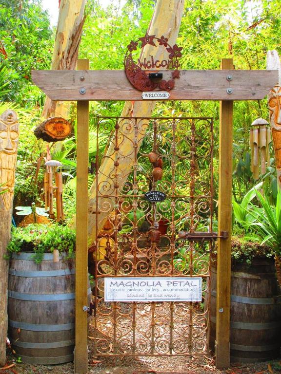 an entrance to a garden with a metal gate at Magnolia Petal in Ganges