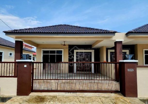 a small house with a balcony with a gate at Sakeena Homestay in Padang Serai