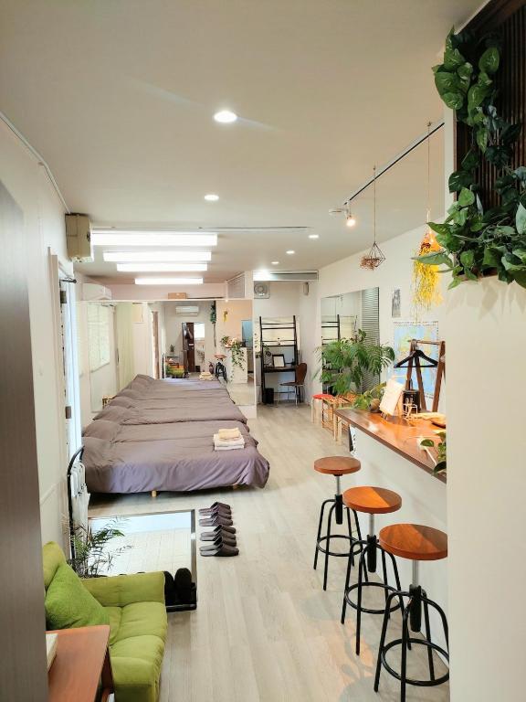a room with a bed and two bar stools at Your Bedroom Hakone in Odawara