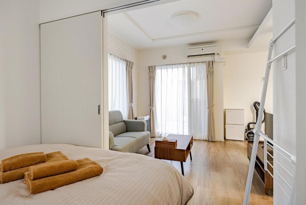 Ένα ή περισσότερα κρεβάτια σε δωμάτιο στο BN Nakajima Park