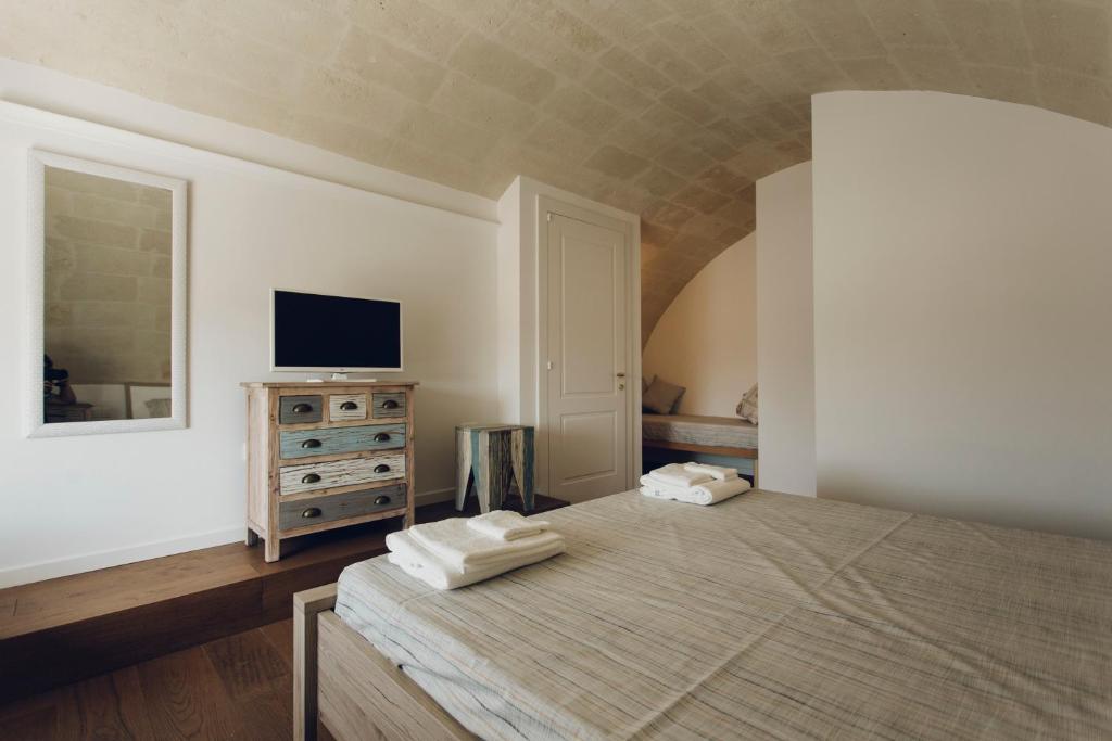 Una cama o camas en una habitación de Le Origini