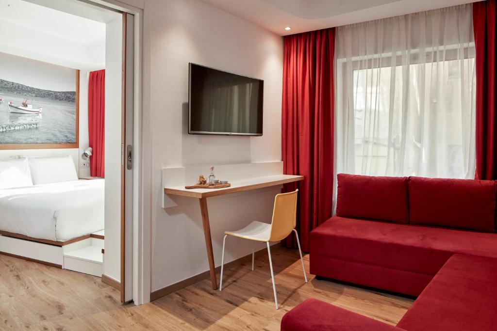 TV a/nebo společenská místnost v ubytování Olive Green Hotel