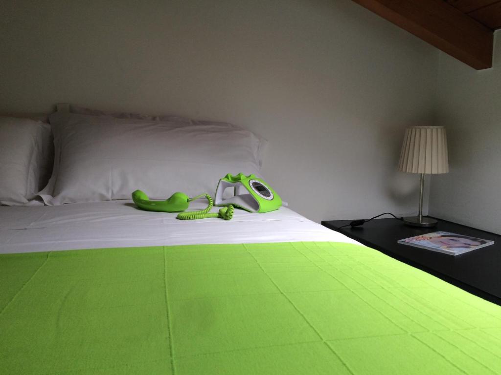 Postel nebo postele na pokoji v ubytování Albergo Giardino
