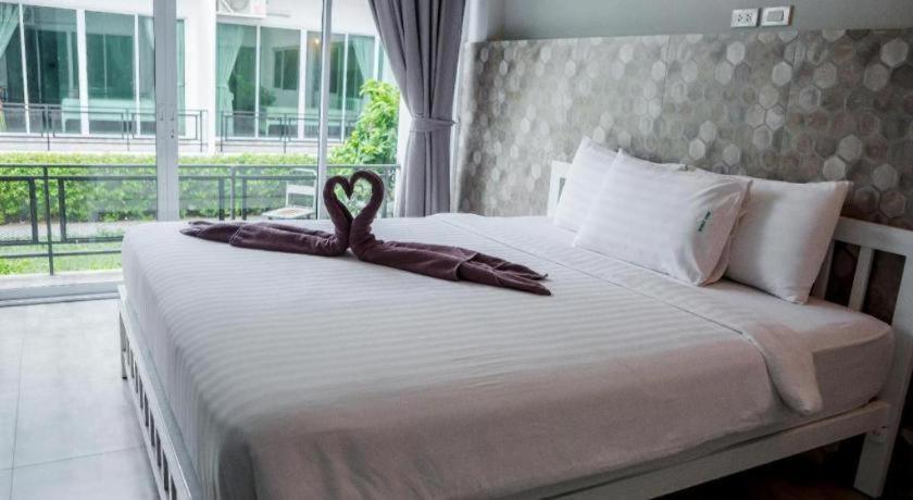 Ένα ή περισσότερα κρεβάτια σε δωμάτιο στο Kosit One Hotel