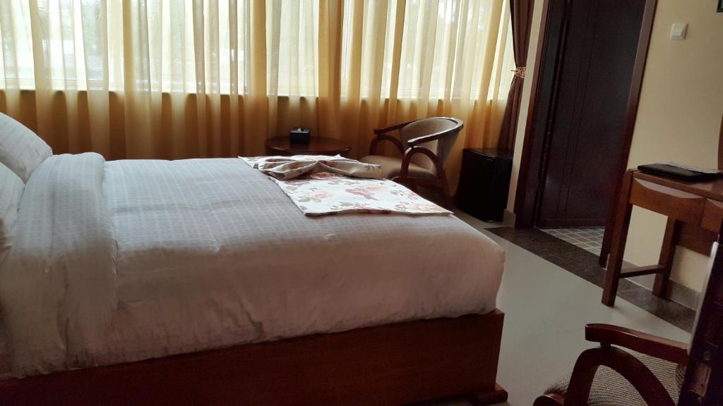 Postel nebo postele na pokoji v ubytování C Fun Addis Hotel
