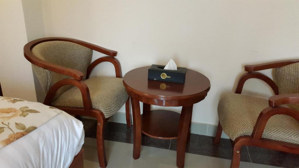 Postel nebo postele na pokoji v ubytování C Fun Addis Hotel