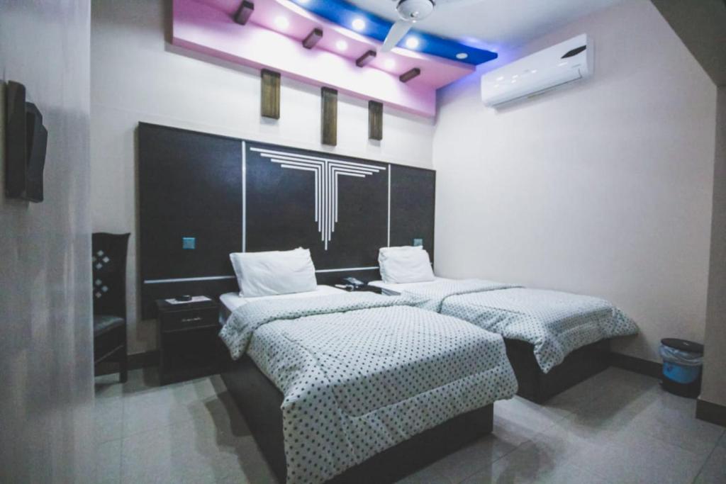 Ένα ή περισσότερα κρεβάτια σε δωμάτιο στο The Hotel Region