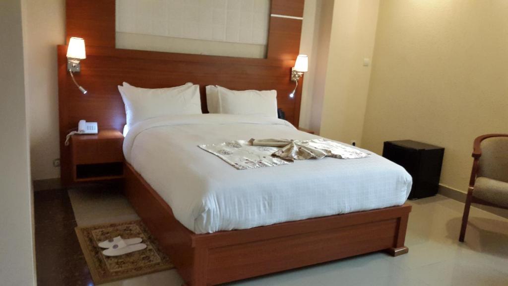 Postel nebo postele na pokoji v ubytování C Fun Addis Hotel
